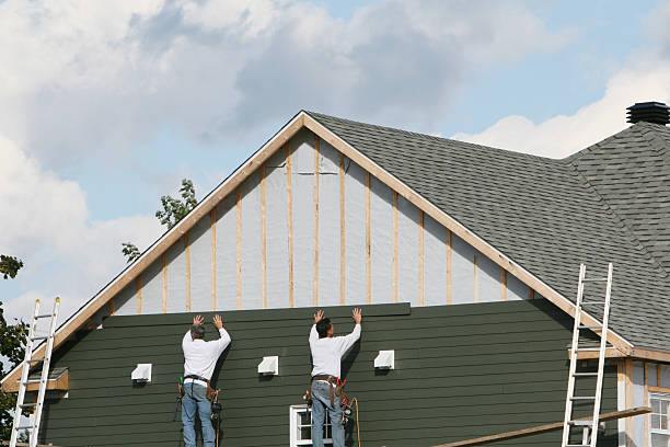 Professional Emergency Siding Repair technician working in Reading, MA